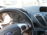 dashboard view of a car with a steering wheel and dashboard controls