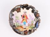 a picture of a miniature picture of a man on a plate