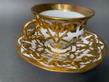a cup and saucer on a saucer on a table
