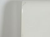a white plate that has a hole in the middle of it