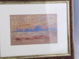 framed picture of a painting of a beach scene in a wooden frame