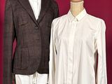 two shirts on a mannequin stand next to each other