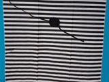 black and white striped blanket with a black cat on a branch