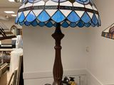 a lamp that is sitting on a table in a room