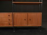 a vintage teak bookcase with two drawers and a shelf