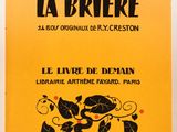 un livre jaune sur lequel figure l'image en noir et blanc d'un chat