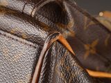 a close up view of a louis vuitton bag