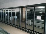 many refrigerators that are lined up in a room