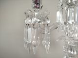 a crystal chandelier hanging from the ceiling