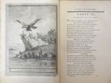 an open book with a picture of a bird on it