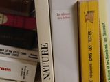 many books that are stacked on top of each other