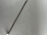 a close up of a metal stick with a long handle