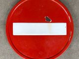 a red sign with a white stripe in the middle of it
