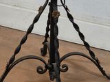 a small table with a glass top and a metal base