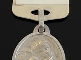 a silver medal that has a picture of a woman on it