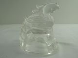 a glass figurine of a bear on a table