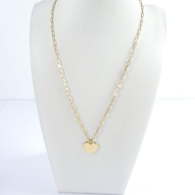 a gold necklace with a heart charm on a mannequin neck