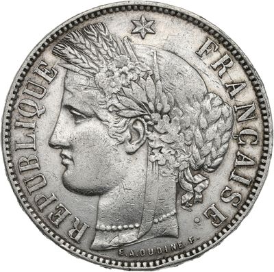 a close up of a coin with a woman ' s head on it