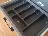 a drawer that has a tray with food inside of it