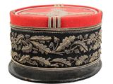 a black and red hat with gold designs on it