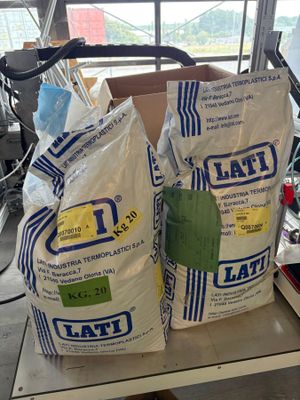two bags of flour sitting on top of a table