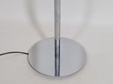 a table with a lamp on top of it on a white surface
