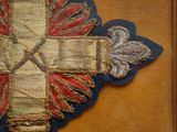 a cross on a piece of cloth on a table