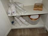 a shelf with a bunch of plates and cups on it