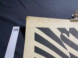 a clipboard with a picture of a zebra on it next to a piece of paper