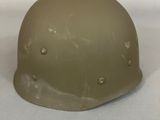 a close up of a helmet on a white surface