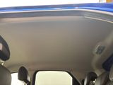 a view of the inside of a car from the driver ' s seat