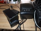 a laptop, a printer and a cell phone on a desk