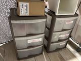 two plastic drawers that are stacked on top of each other