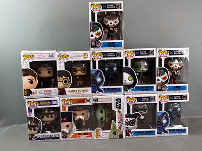 a lot of pop vinyl figures on the table