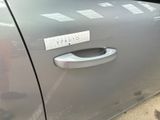 a close up of a car door handle with a sticker on it