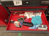 a red drawer that has a lot of items in it
