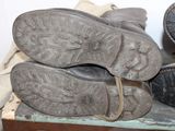two pairs of shoes sitting on top of a wooden box