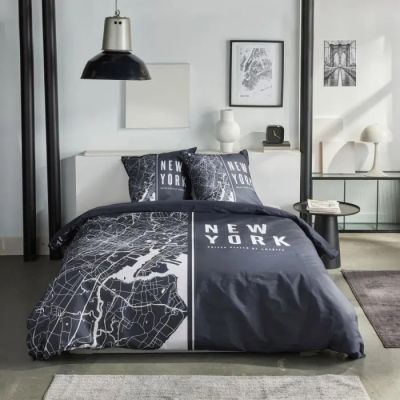 grey and white bedding with a map of new york printed on it