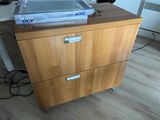 a filing cabinet with a box on top of it