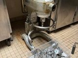 an image of a kitchen with a mixer on the floor