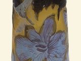 a vase with a blue and yellow flower design on it