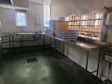 an image of a commercial kitchen with a lot of counter space
