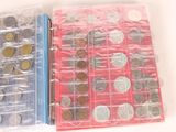 a lot of coins in a plastic case on the table