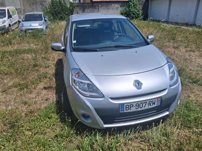 a silver car that is parked in the grass