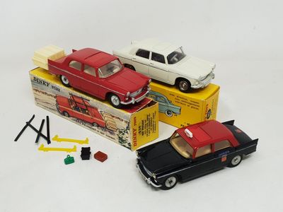 two toy cars that are sitting next to each other