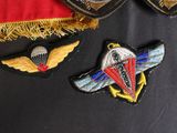 several patches of different colors and designs are on a black surface