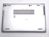a silver laptop with a blue sticker on it