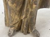 bronze statue of a woman holding a baby in her arms