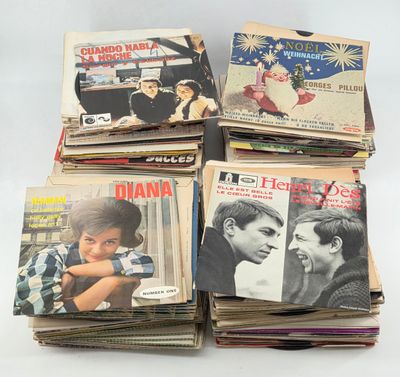 several magazines are stacked on top of each other on a table