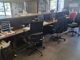 a room with a lot of desks and chairs in it